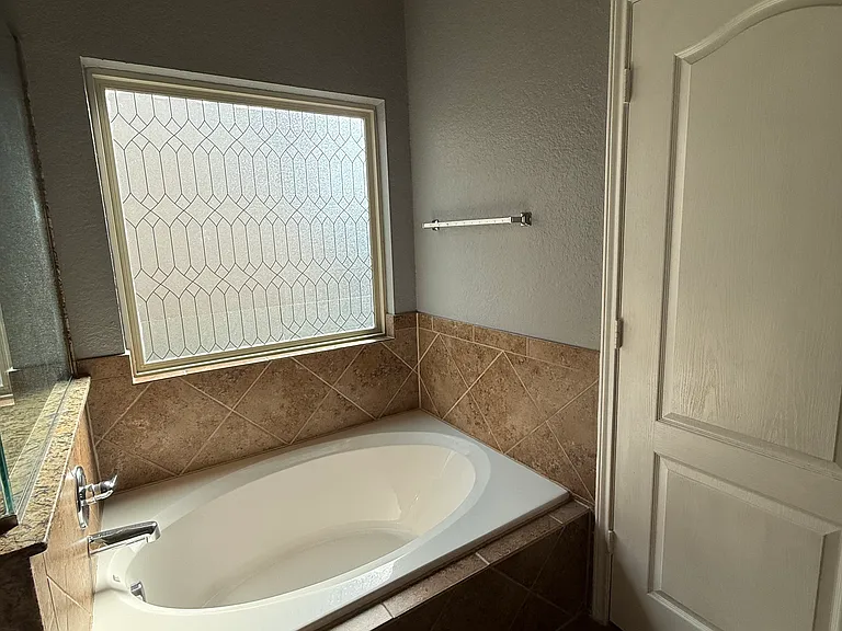 Downstairs bathroom with a sunken in garden tub for aromatherapy baths after a long day