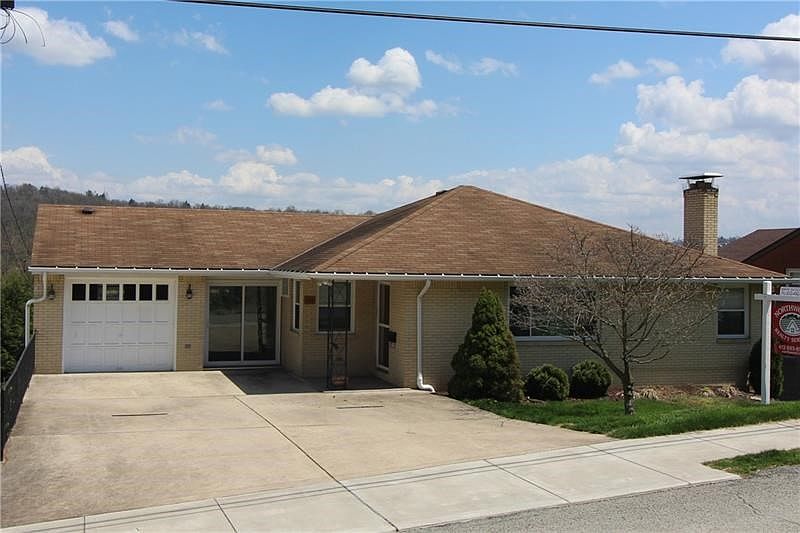 Welcome to 122 Arlington Ave - an updated 4 bedroom 2 bathroom level-entry brick ranch with finished lower level and attached ga
