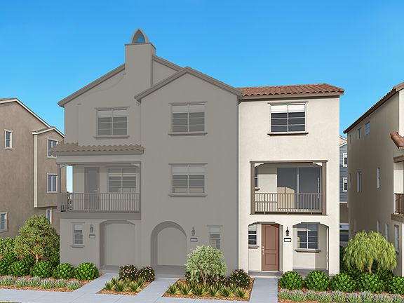 A multi-story residential building with a tiled roof, balconies, and landscaped surroundings against