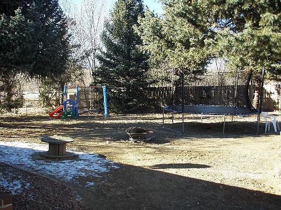 Large back yard with mature trees
