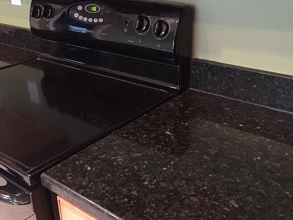 Granite counter tops and smooth top stove.