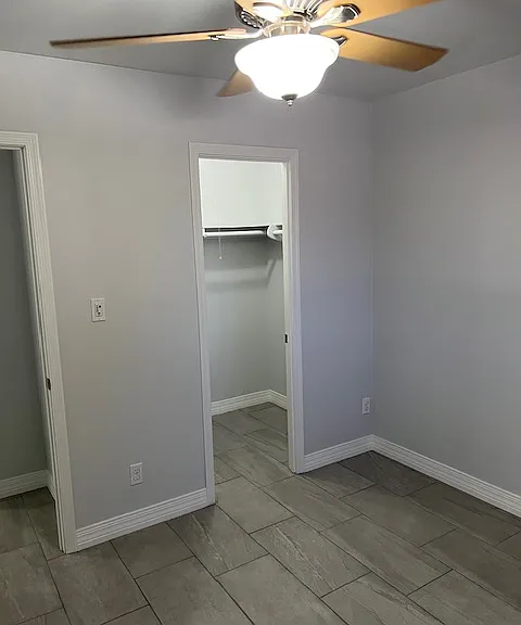 Second Floor Second (2) Bedroom, Walk in Closet. Brand New Tile and Grout, New Baseboard Molding, New Curtains, Ceiling Fan with Light.