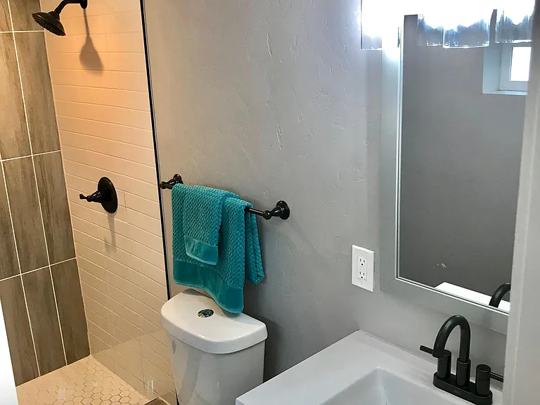 Newly renovated bathroom with gorgeous tile and fixtures.