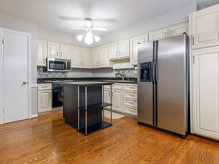 Stainless steel appliances and granite countertops.