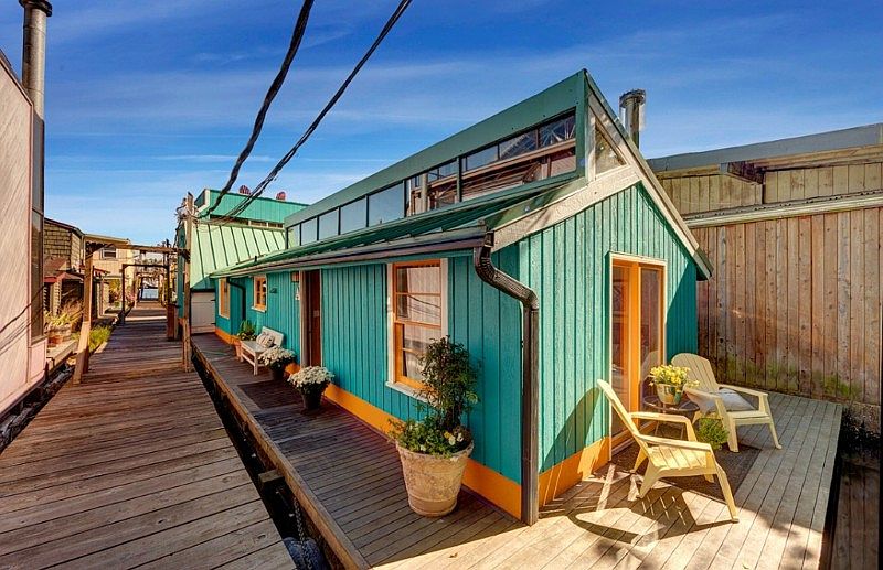 This colorful and artistic floating home was originally 2 homes that were merged into one creating one of the largest floats on the lake. Measuring at 24' by 69' (approx), there is opportunity here to create a masterpiece. Much has been improved already w/ radiant slate floor in LR, new ironwood deck at approx. 1640 sq. ft, updated kitchen and more. A spectacular roof top deck captures endless views.