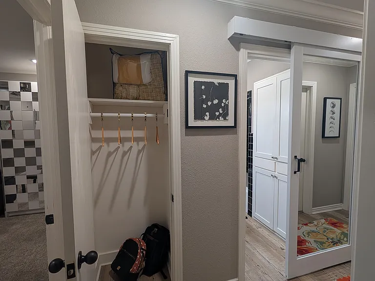 This is the 2nd closet located just outside the bedroom. This closet is between the bedroom and the bathroom.