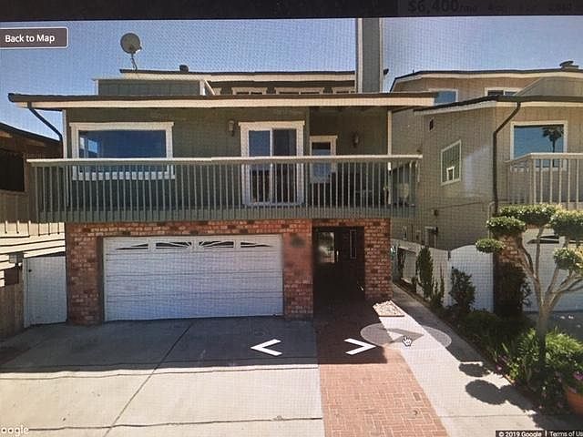 Large, off street ,three car, parking area in front of garage. Second floor outside deck abutting living room.