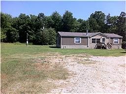 5 acres partially cleared with small pond....