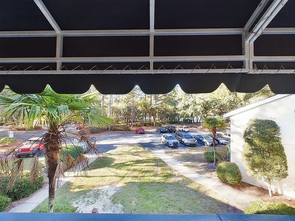 Standing outside the front door looking down at the parking area.