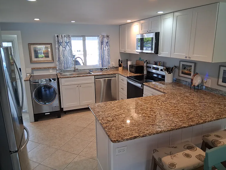 Fully equipped kitchen, built in washer dryer. Lots of counter space and storage.