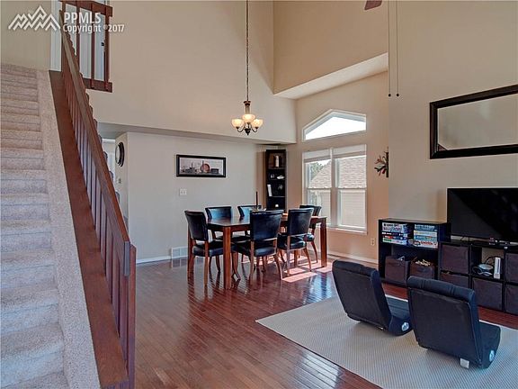 Stunning wood floors, vaulted ceilings and tons of natural light greet you upon