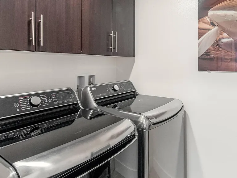 Top of the line appliances throughout. This is the laundry room featuring LG's most advanced and largest capacity washer/dryer pair available.