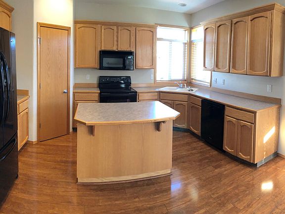 Kitchen with island and pantry.