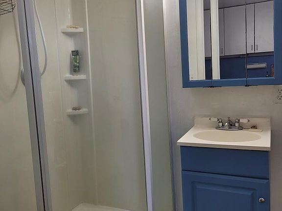 bathroom with shower only. no washer/dryer
