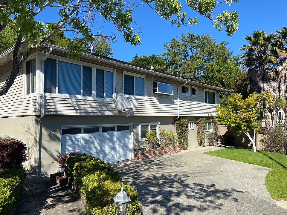 Front of house with extra space for parking.