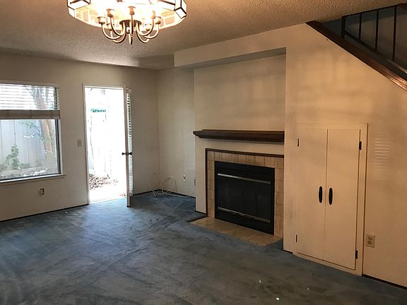 Living Room Fire Place and Door to Patio