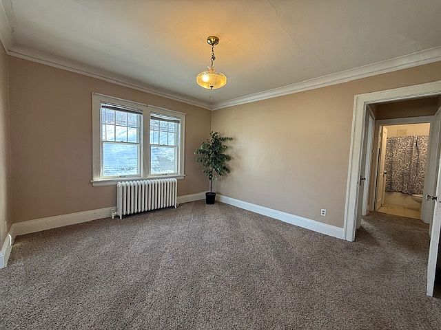Alternative view of dining room including vintage light fixture.