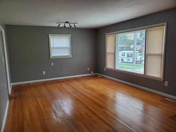Large living room with hardwood floors.