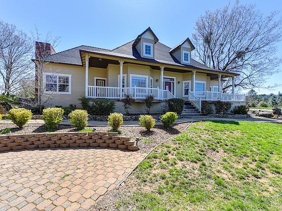 Front View of Home with Patio Area - all new Redwood Decking around the home.