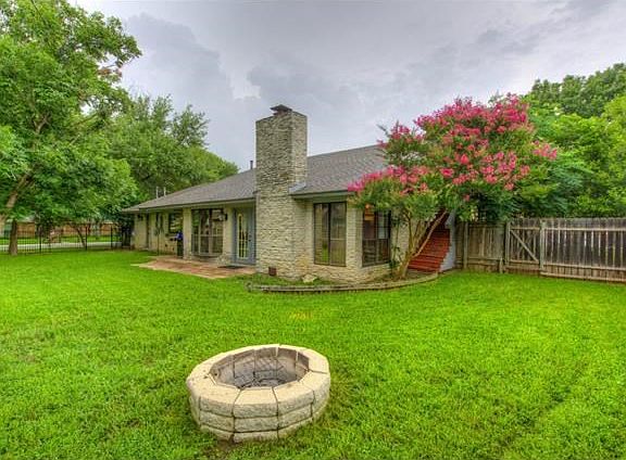Enjoy the backyard - enough room to play and entertain around the fire pit.