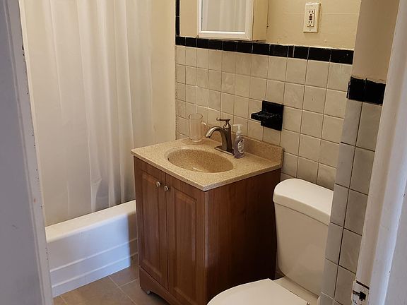 bathroom - new tile floors, cab and toilet. Freshly Painted