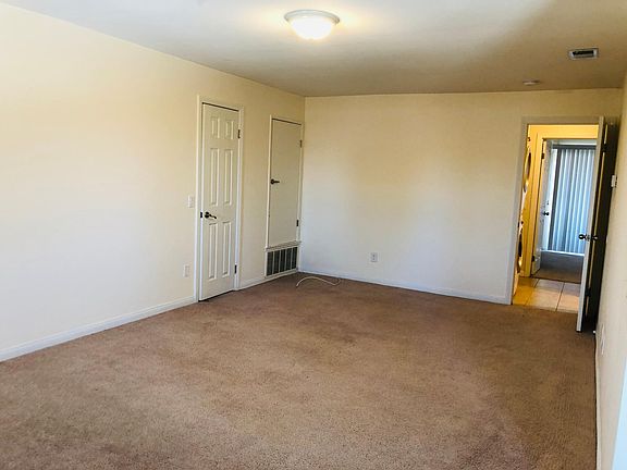 big living room with lots of light.