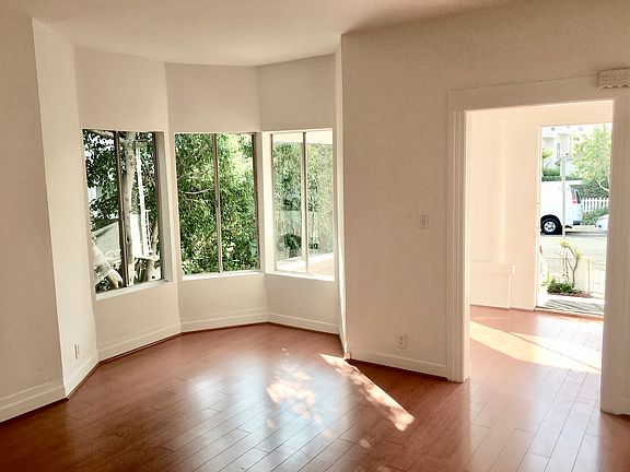 Living room with bay windows
