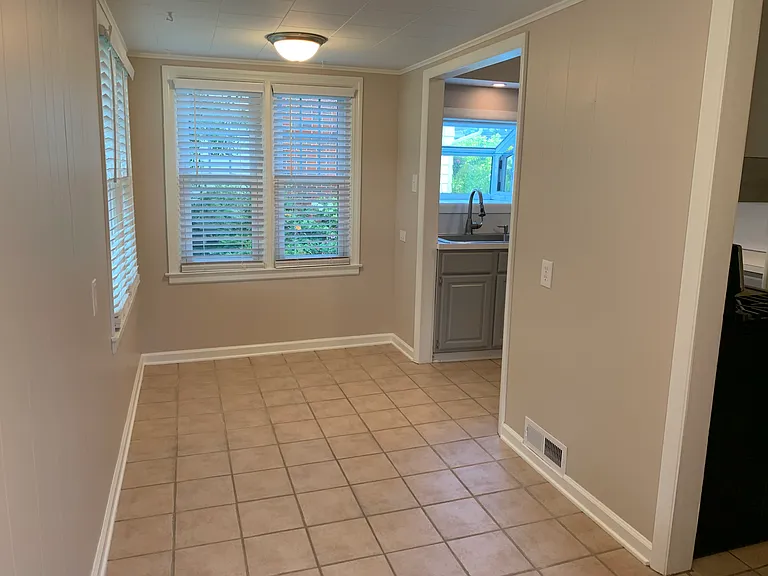 Eat-in kitchen area with great natural light that leads to deck