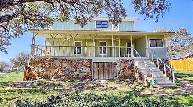 Front of house w great porch for relaxing and taking in the peaceful surroundings!