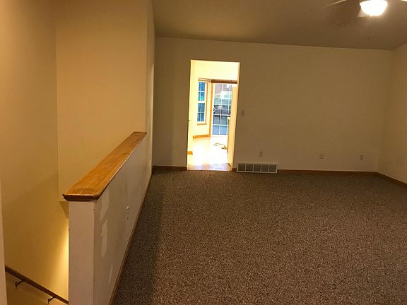 Living Room with open stairway to full basement