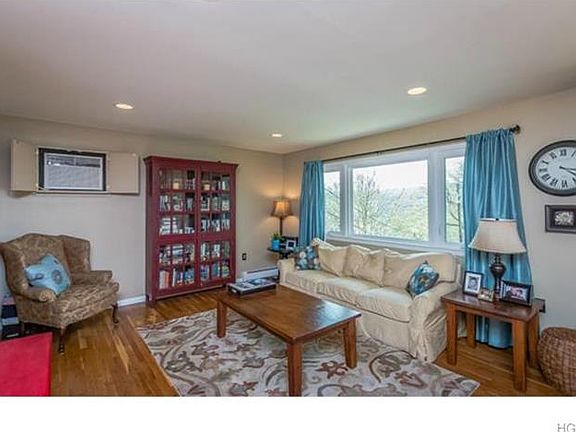 The beautifully appointed living room with hardwood floors.