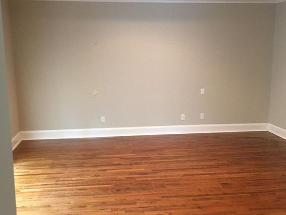 Huge Owner_s suite featuring double coffered ceilings and picture window bathing room in natural light.