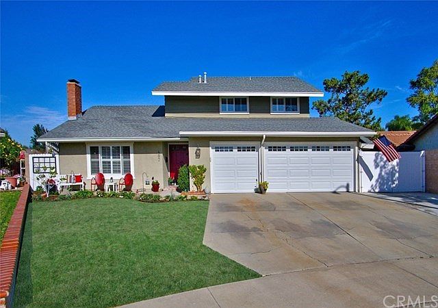 Professionally Landscaped Front Yard with Concrete Front Porch/Sitting Area.  Three Car Garage and Gated RV Access.