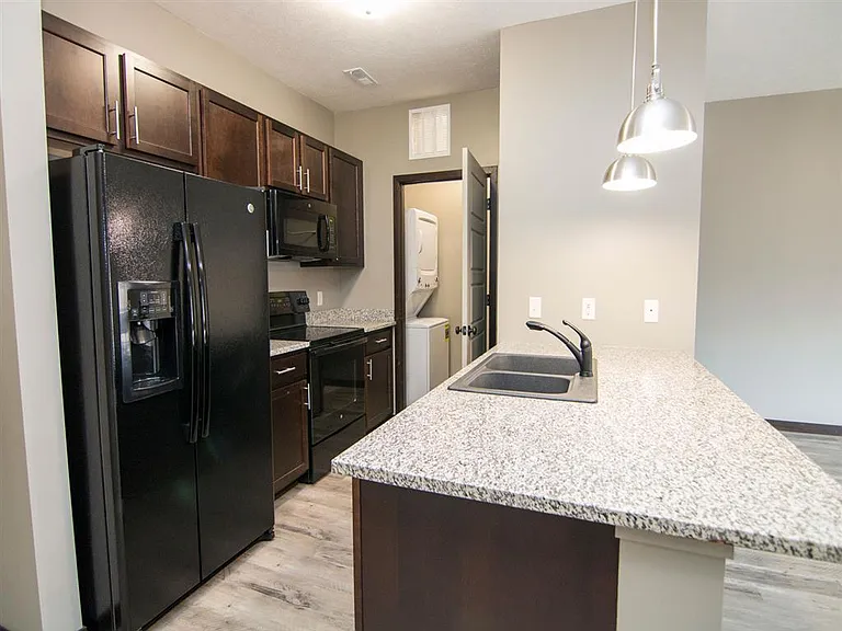 Modern kitchens with sleek appliances and granite countertops offer the ideal setup for cooking and entertaining.