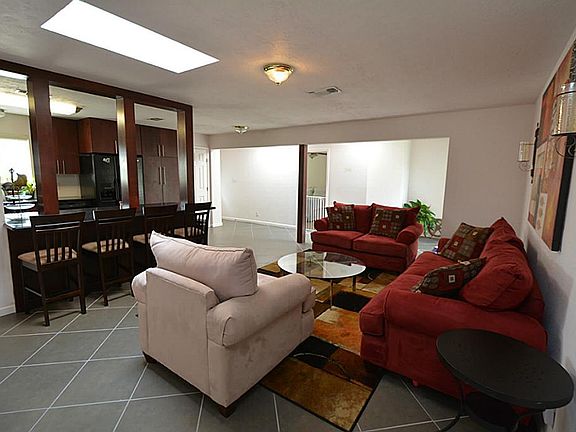 Entry to the family room with gorgeous tile and open to the kitchen.