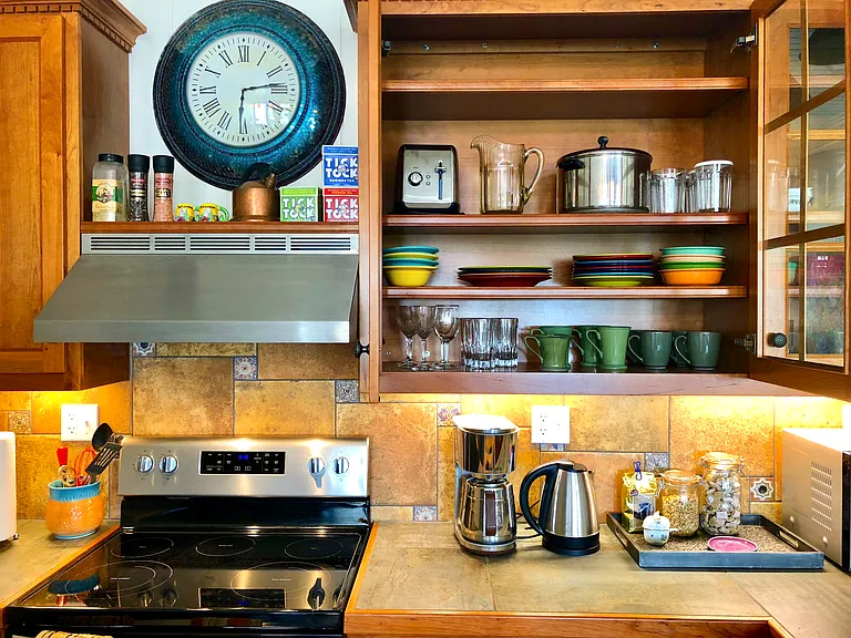 Our kitchen is fully-stocked with restaurant quality silverware, vintage fiesta-ware plates & bowls, coffee mugs, glasses, mixing bowls, strainer, several sized pots and pans; bottle, wine, & can opener; strainer, spatula and serving spoons, and more!