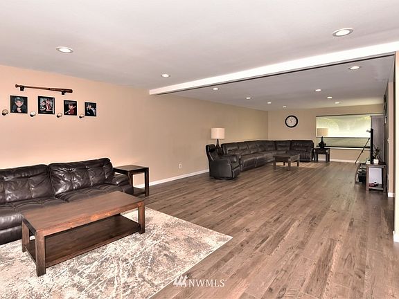 So much room to let your imagination flow with what you can do with this living room / rec area. New flooring and carpet throughout this beautifully remodeled living area.