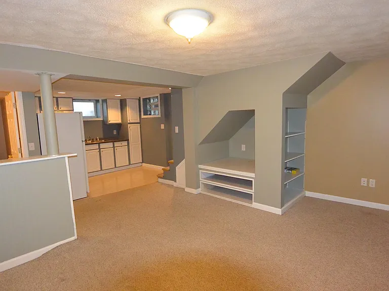 Lower level living room and kitchen.