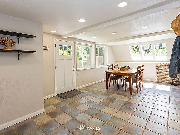 Front Entrance, Dining Room, Wood Fireplace (Photo from Previous Listing)