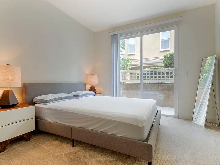 Furnished+ apartment homes feature queen bed with mattress, two pillows, dresser, nightstands, lamp, and mirror. (Representative Image exact items and style of furnishings may vary)