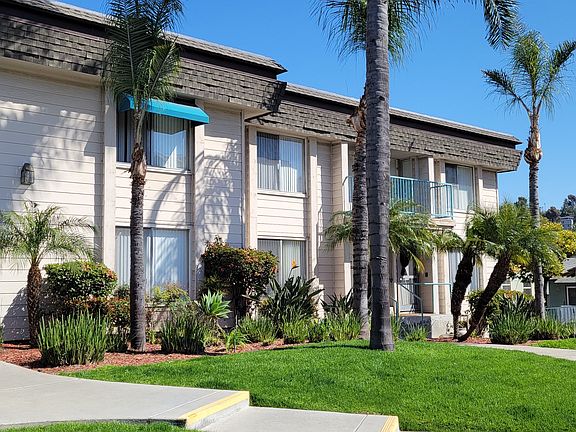 Sidewalk view of the front enterance to La Mesa Village apartments.