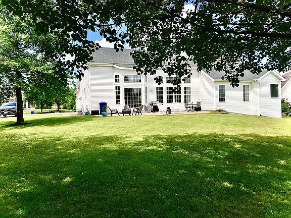 Level tree lined back yard 