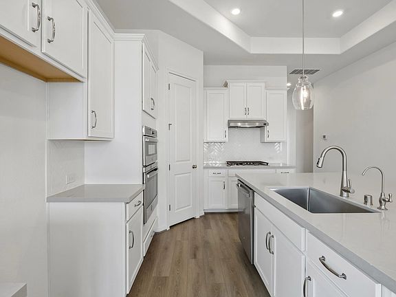 Kitchen. Sample product photo. Actual exterior and interior selections may vary by homesite. Photo m