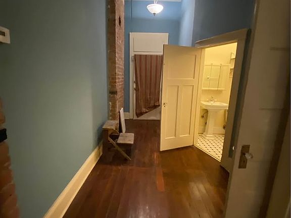 Hallway to pantry, second bathroom, third bedroom, backdoor to porch