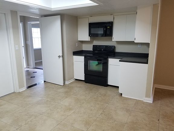 Kitchen looking at the foyer door. 2800 Lk Arnold Pl