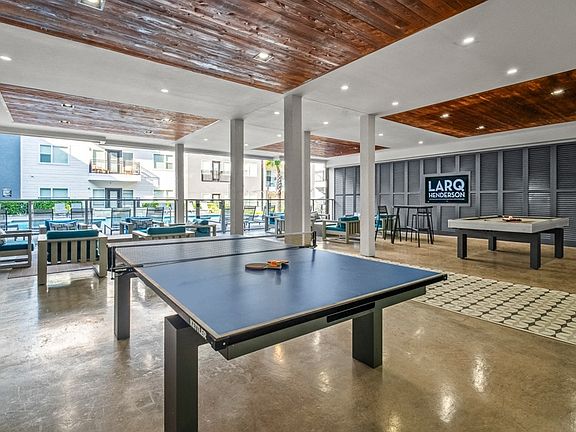 Covered game room with ping pong and billiards table