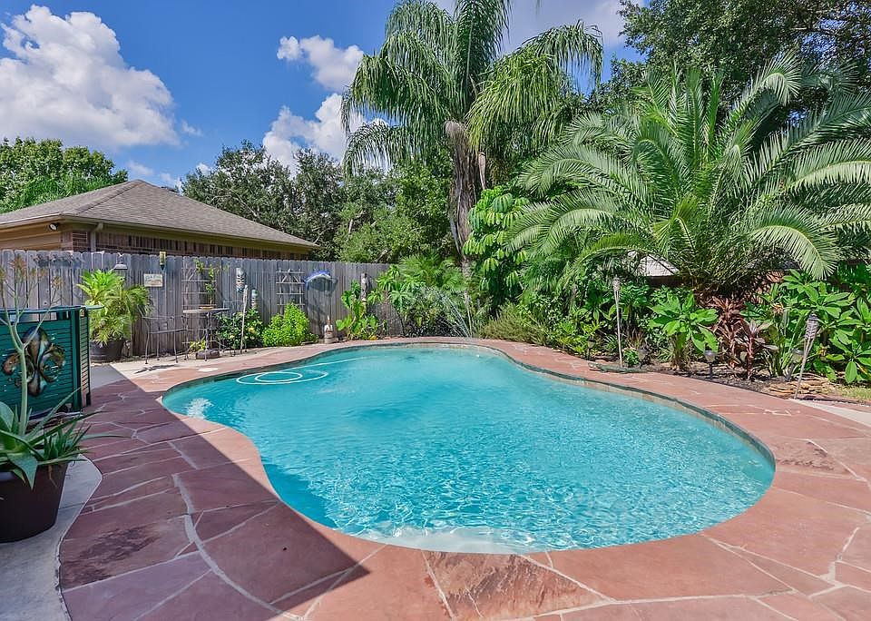 Come home and take a dip in this sparking backyard pool.