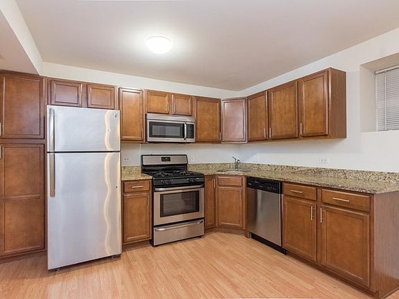 stainless steel appliances and granite countertops with dish
