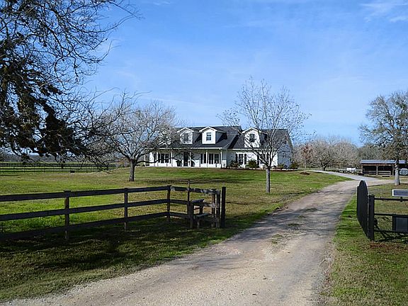 A solar powered electronic gate opens to a world of fine country living. A variety of beautiful mature trees populate the nearly 3.5 acres, adding natural beauty and welcomed summer shade