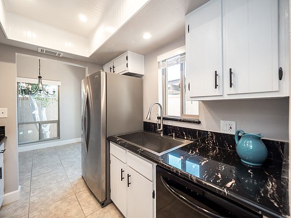 Light and bright kitchen with farmhouse sink.